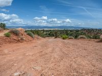 Straight Road in Utah: Clouds, Dirt, and Gravel Streets