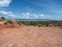 Straight Road in Utah: Clouds, Dirt, and Gravel Streets