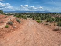 Straight Road in Utah: Clouds, Dirt, and Gravel Streets