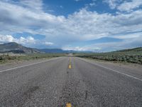 Straight Road in Utah: A Path Through the Clouds and Nature