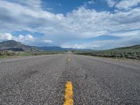 Straight Road in Utah: A Path Through the Clouds and Nature