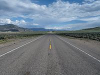 Straight Road in Utah: A Path Through the Clouds and Nature