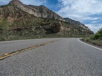 Straight Road in Utah, USA: Clouds and Mountains