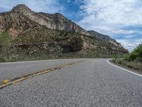 Straight Road in Utah, USA: Clouds and Mountains