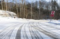 Straight Road through Winter Forest in Canada