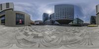 a large circular image of buildings in a city park, with an outside plaza area