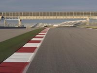 A Straight View: Asphalt Road and Clear Skies