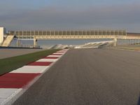 A Straight View: Asphalt Road and Clear Skies