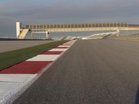 A Straight View: Asphalt Road and Clear Skies