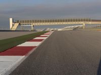 A Straight View: Asphalt Road and Clear Skies