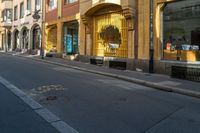 the city street is full of street signs on each side of it with a bench sitting in the middle