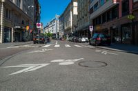 a street with bicycle lanes and street signs on the side of it and some buildings