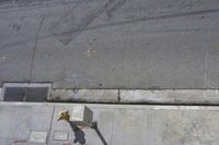 the sidewalk has graffiti painted on it and writing in blue ink next to an outside fire hydrant