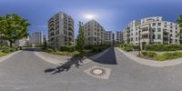 there is an overhead view of buildings on this street corner in a circular panoramic mirror