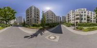 there is an overhead view of buildings on this street corner in a circular panoramic mirror