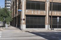 this is a street corner near an old building with an american flag and a traffic light in front of it