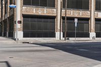 this is a street corner near an old building with an american flag and a traffic light in front of it