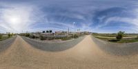 this is a fish - eye view of a street near the golf club's parking