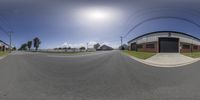 this 360 - view shows street level perspective at a stop sign in front of a garage building