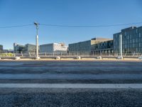 street intersection on the waterfront with buildings on both sides and empty lot in the middle