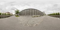 a view from the side of a street through a fisheye lens on a concrete walkway