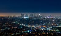 a city that looks like it has lights on the buildings at night time in los angeles, california