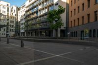 a building with large windows is located in a city square with no traffic on it