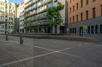 a building with large windows is located in a city square with no traffic on it