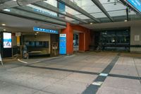 a bus station with an indoor sign and a television set outside it's front door