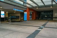 a bus station with an indoor sign and a television set outside it's front door