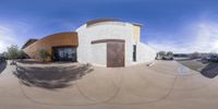 a reflection of a small building on a street in arizona, usa the circular is one of several pictures to be viewed