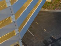 a view of a road and an overpass with traffic passing through it by buildings