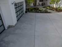 a patio that has been cleaned and ready to be painted in silver with a black door