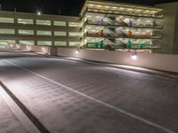 a view of a road and an overpass with traffic passing through it by buildings