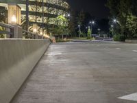 a view of a road and an overpass with traffic passing through it by buildings