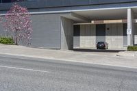 parked cars and cars parked in front of a garage with roller shutters over it