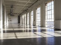 sunlight shines through large windows in a building that overlooks a city outside on its sides