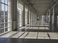 sunlight shines through large windows in a building that overlooks a city outside on its sides