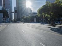 the sun shines brightly on a quiet urban street in san francisco, california, during the day