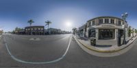 an intersection with no cars in the background, in a fisheye image that is 360 - view