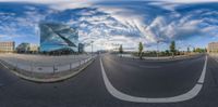 a view of a road in a big city at the day time, from a fisheye lens