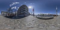 360 - view of the building and the street in front of it shows an urban setting with cobblestones