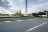 Sunny Day on Germany's Rural Highway with Concrete Bridge
