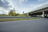 Sunny Day on Germany's Rural Highway with Concrete Bridge