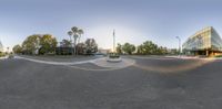 the curved street with a curve drawn through it's center is filled with palm trees