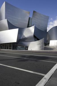 the building in front is made from aluminium sheet with a curved top and side wall