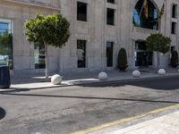 a crosswalk on a city street with buildings around it on a sunny day,