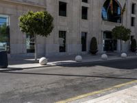 a crosswalk on a city street with buildings around it on a sunny day,