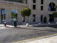 a crosswalk on a city street with buildings around it on a sunny day,