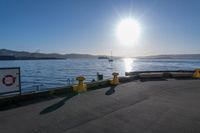 the sun shines brightly over the ocean on a sunny day at a marina in san francisco, california